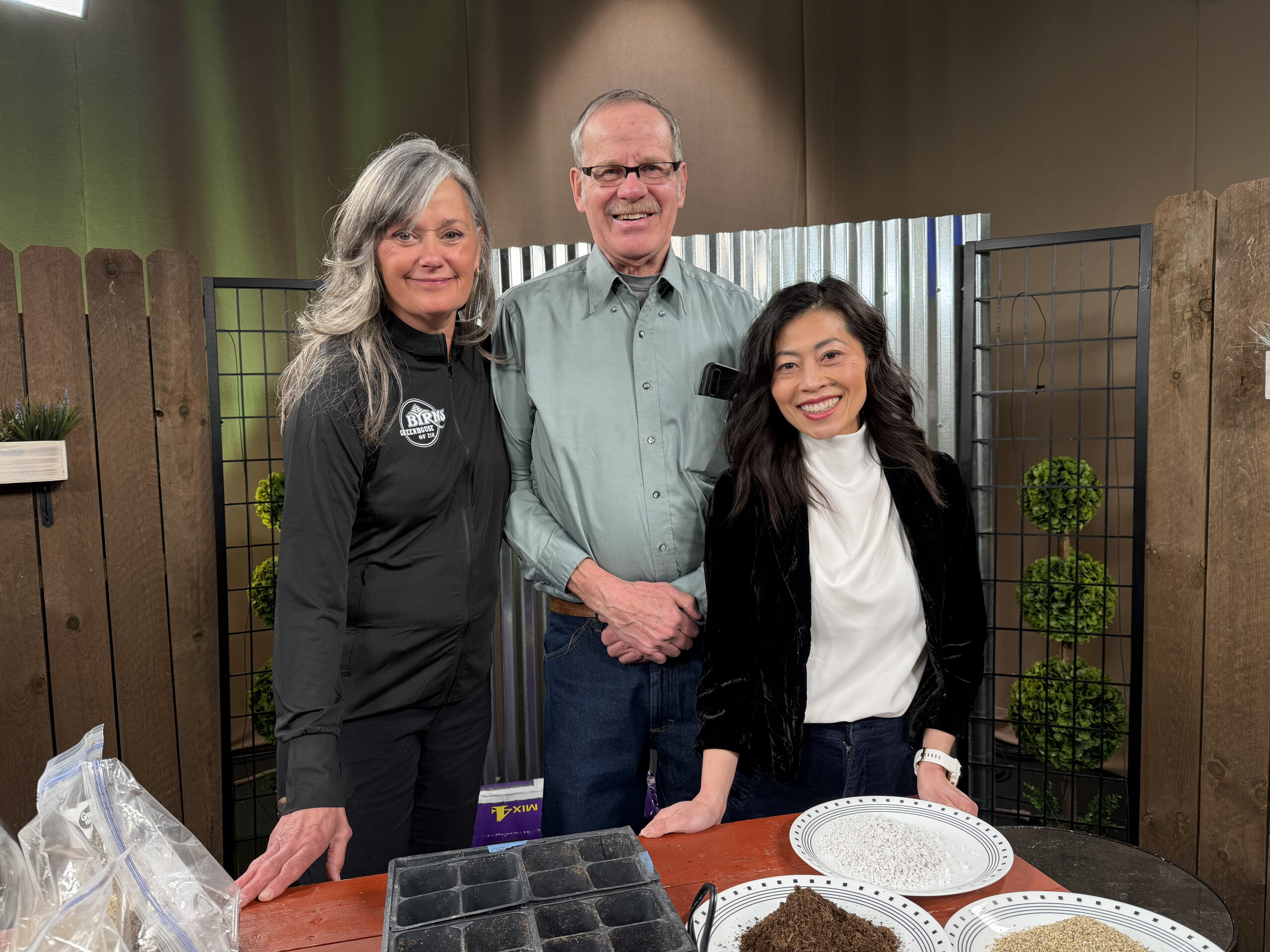 Great Gardening 3 humans in front of a table